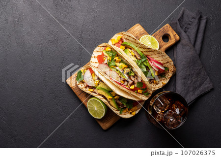 Mexican food featuring tacos Mexican food featuring tacos 107026375