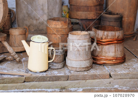 Wooden traditional pot in vintage style. Ukrainian cultural national style. Installation in museums of traditional rural household items. Wooden traditional pot in vintage style. Ukrainian cultural national style. Installation in museums of traditional rural household items. 107028970