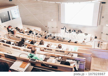 Conference and Presentation. Audience at the conference hall. Business and Entrepreneurship. Faculty lecture and workshop. Audience in the lecture hall. Academic education. Student making notes. Conference and Presentation. Audience at the conference hall. Business and Entrepreneurship. Faculty lecture and workshop. Audience in the lecture hall. Academic education. Student making notes. 107028987