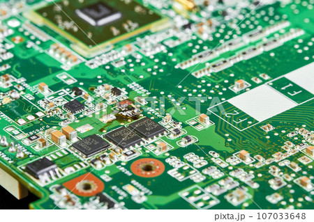 Close-up of computer chip on a part of electronic printed circuit board 107033648