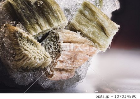 Focus stack of freezer burned rhubarb with ice crystals  107034890
