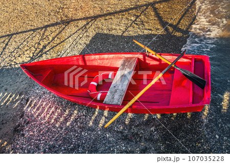 red rescue boat on the shore, top view 107035228
