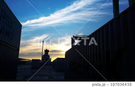 Container terminal. Sea port container terminal during work at night in fog 107036438