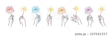 Sparklers in human hands. 107042357