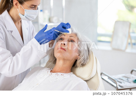 Facial injection mature patient Facial injection mature patient 107045376
