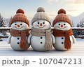 cute family snowman, wearing a knitted scarf and hat 107047213