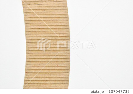 closeup brown paper cardboard texture on white background closeup brown paper cardboard texture on white background 107047735