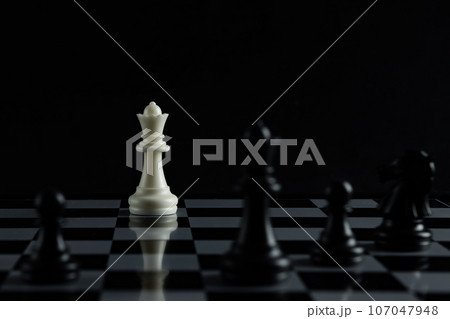 Pieces on chess board on black background for playing game and strategy. Pieces on chess board on black background for playing game and strategy. 107047948
