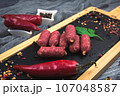 Spicy sausages with hot pepper flavor. Beautiful and appetizing sausages. 107048587
