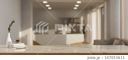 Empty mockup space on a tabletop with a blurred, modern reception room in the background. 107053611
