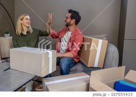 Young man and woman feeling excited and happy 107055413