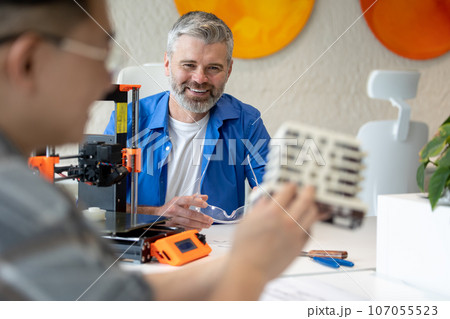 Architects making house model working with 3D printer, creating process. 107055523