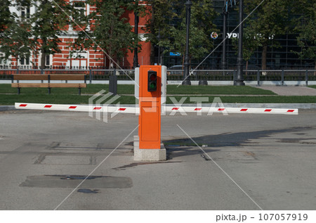 Two barriers for entry and exit from street parking Two barriers for entry and exit from street parking 107057919