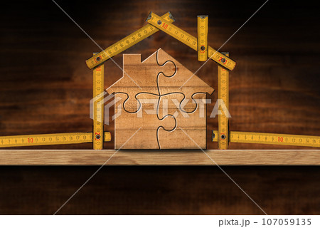 Wooden House Made From a Folding Ruler and Puzzle Pieces 107059135