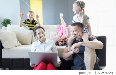 Family with children spend their home time in quarantine 107059724