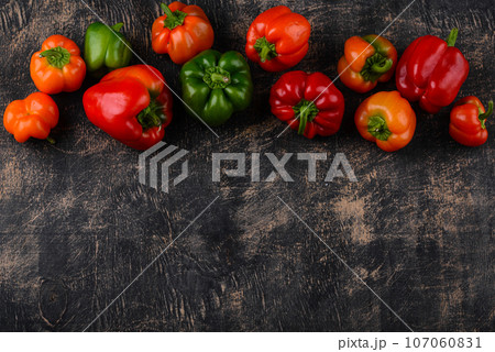 Colorful bell pepper on black background Colorful bell pepper on black background 107060831