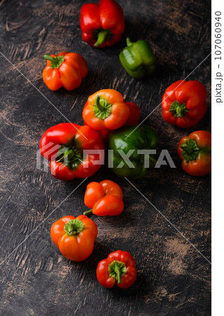 Colorful bell pepper on black background 107060940