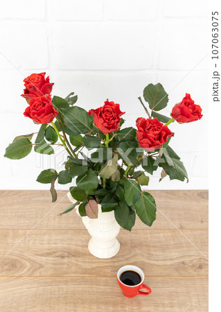 Beautiful bouquet of red roses in a ceramic vase. Beautiful bouquet of red roses in a ceramic vase. 107063075