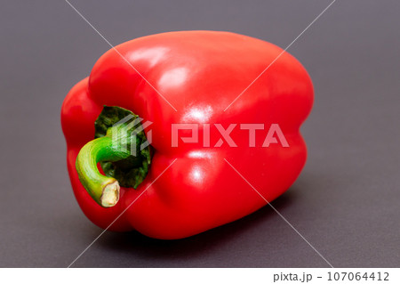 Red Bell Pepper on Black Background 107064412