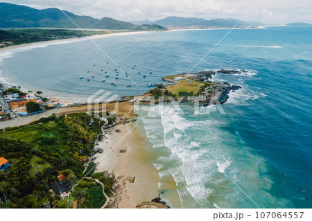 Coastline with beach and ocean with waves in Brazil. Aerial view of Matadeiro Beach in Santa Catarina 107064557