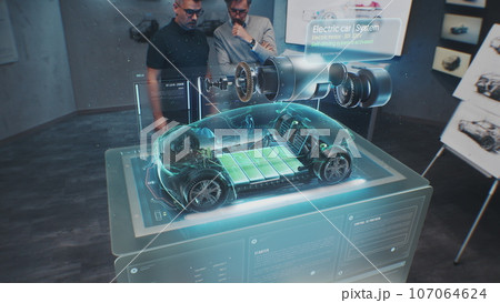 Automotive engineers develop new electric car 107064624