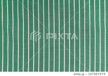 Green white striped fabric texture background with copy space Green white striped fabric texture background with copy space 107065974