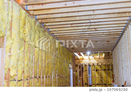 Mineral wool wall building with fiber cotton thermal insulation with under construction 107069280