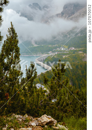 landscape with Fedaia lake and forest landscape with Fedaia lake and forest 107070052