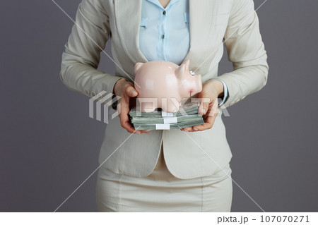Elegant business owner woman in light business suit 107070271