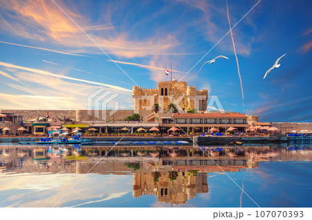 Qaitbay Fort reflecting in the sea waters by the cost of Alexandria, Egypt Qaitbay Fort reflecting in the sea waters by the cost of Alexandria, Egypt 107070393