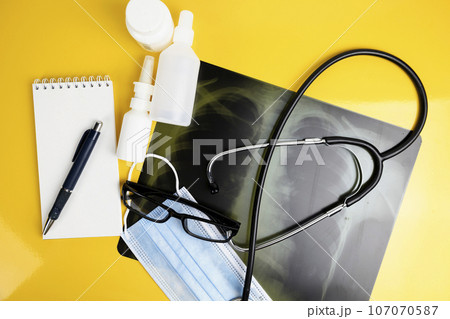 x-ray of the lungs, X-ray film of the patient. medical concept. Coronavirus infection COVID-19 x-ray of the lungs, X-ray film of the patient. medical concept. Coronavirus infection COVID-19 107070587