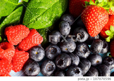 Fresh organic blueberries and raspberries. Blueberry and raspberry.Healthy eating,diet concept 107070596