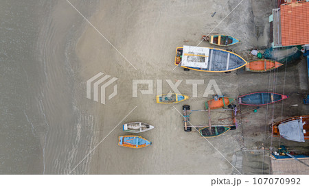 Aerial great view at empty fishermen boats during low tide on the sea Aerial great view at empty fishermen boats during low tide on the sea 107070992