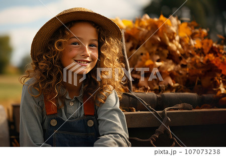 Cute little country farmer girl sitting amongst the fall foliage on the tractor - generative AI. 107073238