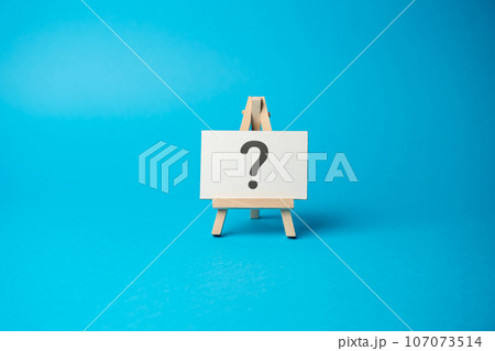 Question mark on the stand. Asking questions and seeking answers. Explore the unknown and seek information. Search for solutions. Critical thinking, evaluation, and analysis. Question mark on the stand. Asking questions and seeking answers. Explore the unknown and seek information. Search for solutions. Critical thinking, evaluation, and analysis. 107073514