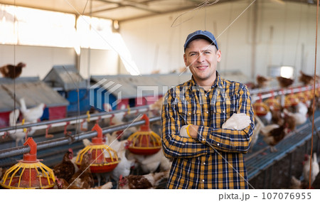 Portrait of a male farmer in poultry farm Portrait of a male farmer in poultry farm 107076955