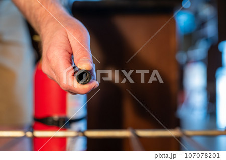 View from inside an oven with selective focus on a extinguisher being aimed at the fire. View from inside an oven with selective focus on a extinguisher being aimed at the fire. 107078201