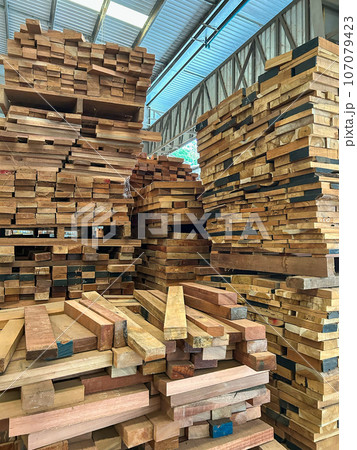 Woods stack in the sawmill. Pile of woods on shelves in factory Woods stack in the sawmill. Pile of woods on shelves in factory 107079423