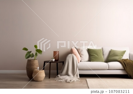 Interior design of living room with copy space, beige sofa, side table, leaf in vase, pouf, elegant accessories and boucle rug. Beige wall. Minimalist home decor. Template. 107083211