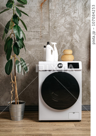Washing machine in a gray modern laundry room Washing machine in a gray modern laundry room 107084253