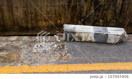 Broken guide post on the road side hit by a drunk driving car concept of don't drunk and drive Broken guide post on the road side hit by a drunk driving car concept of don't drunk and drive 107085906