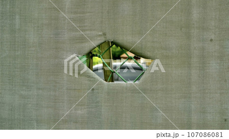 tear holes in canvas used outdoors 107086081