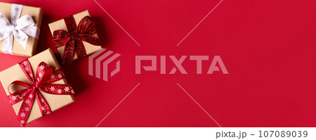 Christmas gift boxes with red balls. 107089039