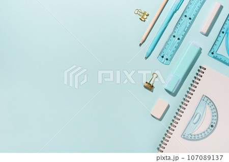 School supplies on blue background. School supplies on blue background. 107089137