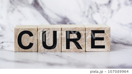 Cure- text on wooden blocks, medical concept, light background 107089964