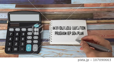 Woman hand writing IEP 504 Individual Education Plan Conceptual business photo 107090663