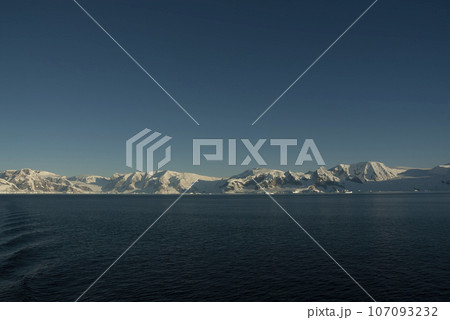 Lemaire strait coastal landscape, mountains and icebergs, Antarctic Peninsula, Antartica. Lemaire strait coastal landscape, mountains and icebergs, Antarctic Peninsula, Antartica. 107093232