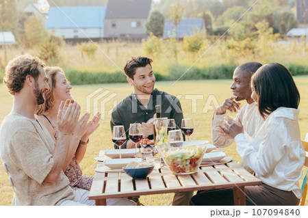 Joyful Multiracial Millennial Friends at Garden Party 107094840