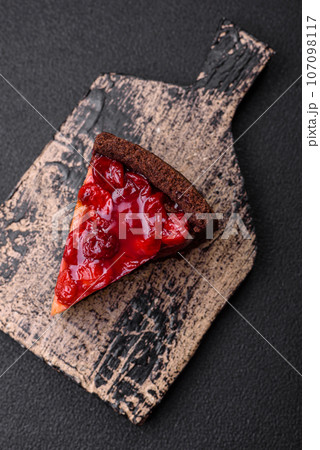 Delicious sweet cheesecake cake with mascarpone cheese, cherry berries and jam 107098117