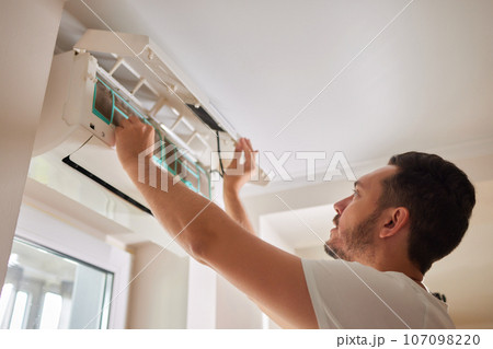 Dirty air conditioner filter need cleaning. Air conditioner service, repair and clean equipment. 107098220